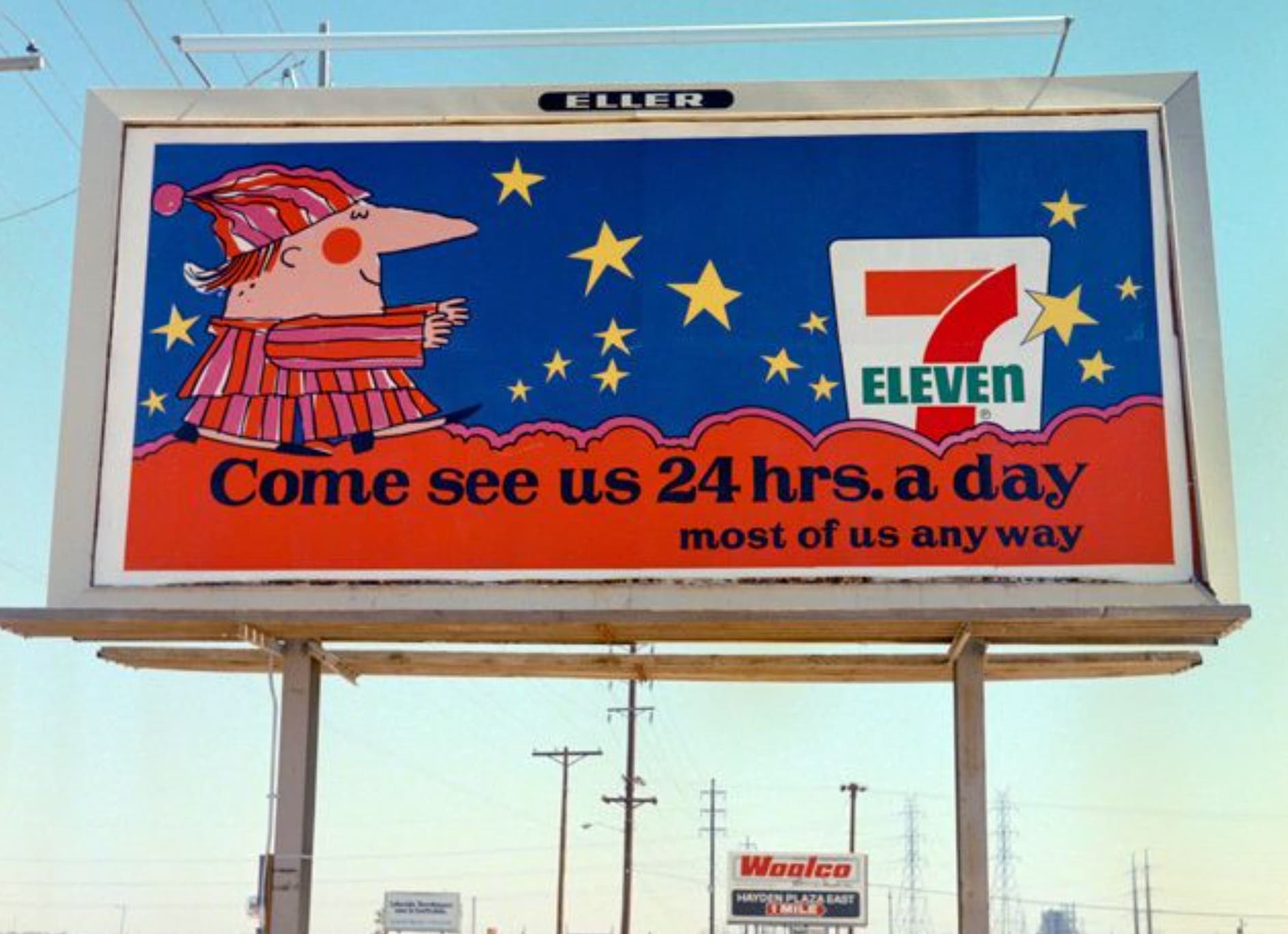 billboard - Eller Eleven Come see us 24 hrs. a day most of us any way 13 Woolco Hayden Plaza East Smile